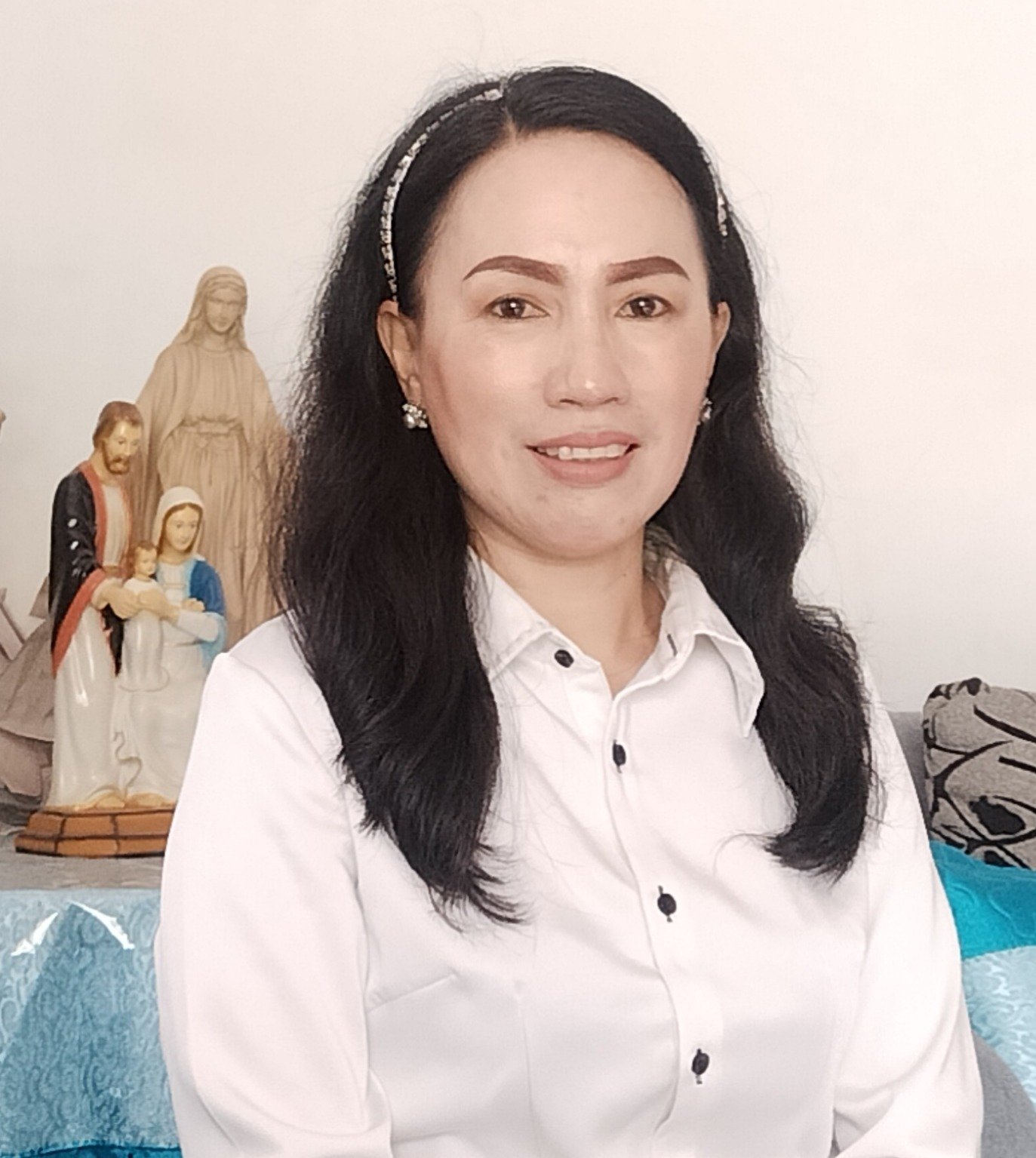 Ervi H. Mandagi, S.Pd